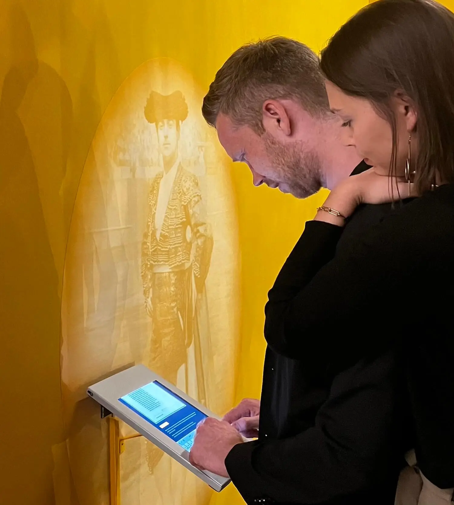 Visitors, talking to a chatbot on an iPad